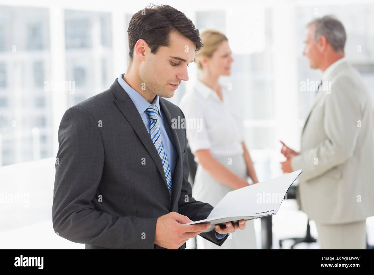 Female executives reading document hi-res stock photography and images ...