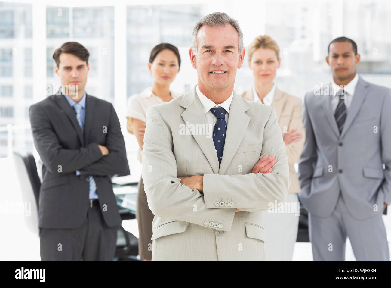 Diverse business team smiling at camera in the office Stock Photo - Alamy