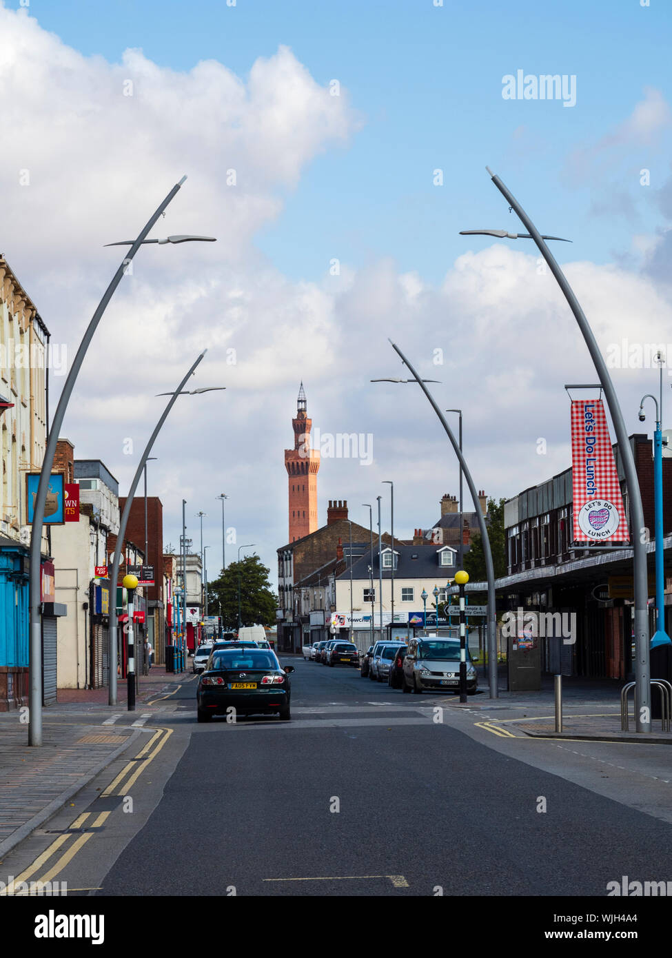 Grimsby's landmark dock tower framed by the arching streetlights of Freeman Street in the North East Lincolnshire town Stock Photo