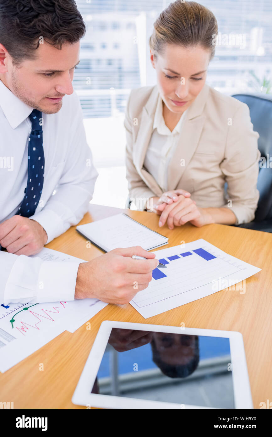 Smartly dressed young man and woman in a business meeting at office ...