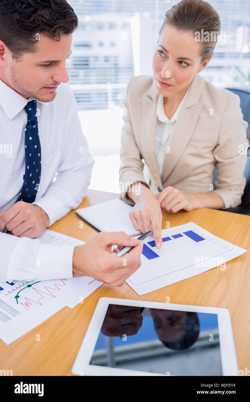Smartly dressed young man and woman in a business meeting at office ...
