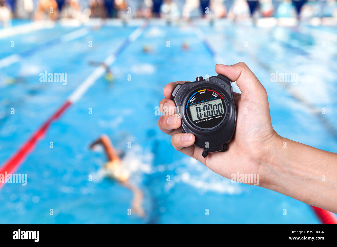 Cropped Image Of Coach Holding Stopwatch Against Swimming Pool Stock Photo  - Alamy