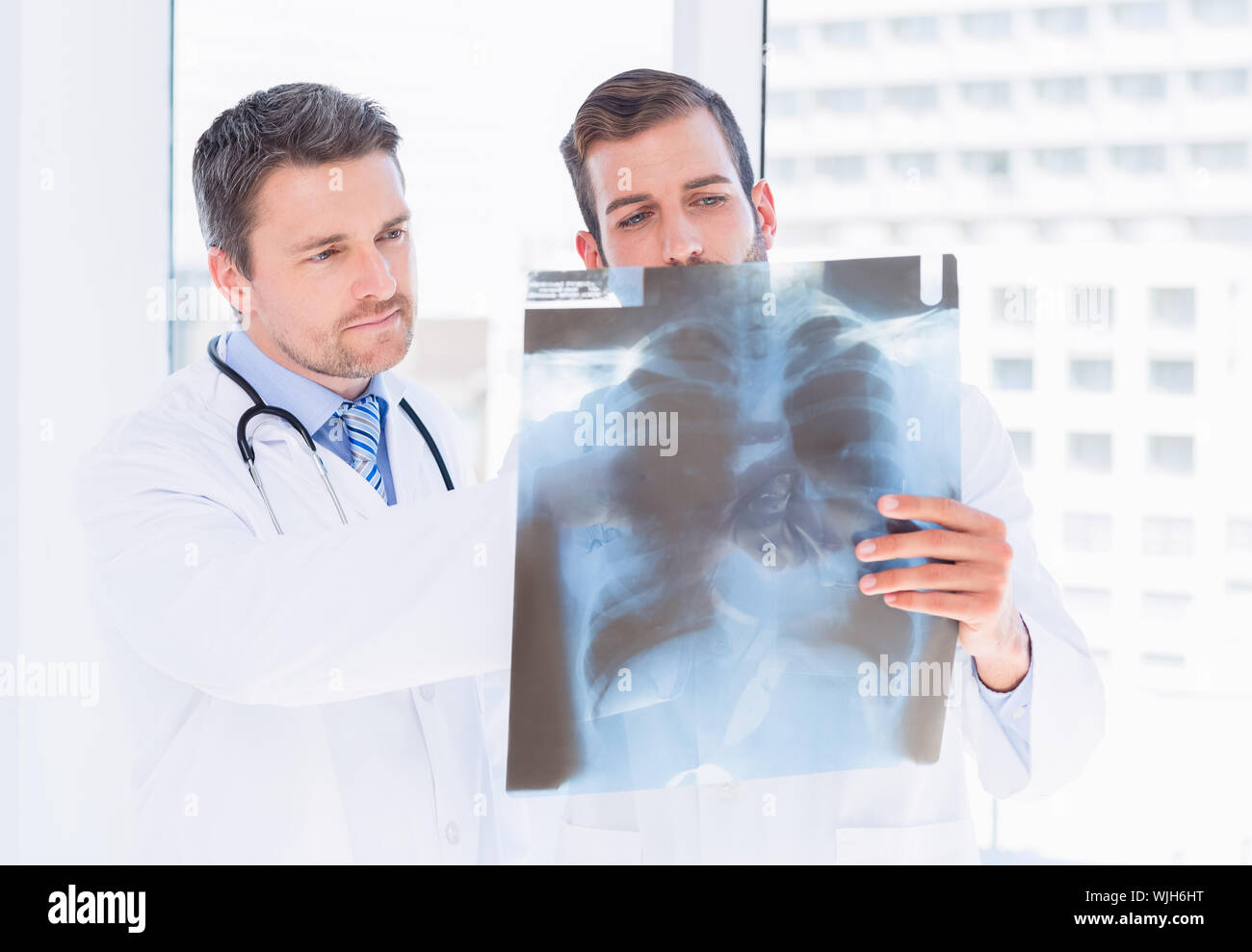 Two male doctors examining hi-res stock photography and images - Alamy