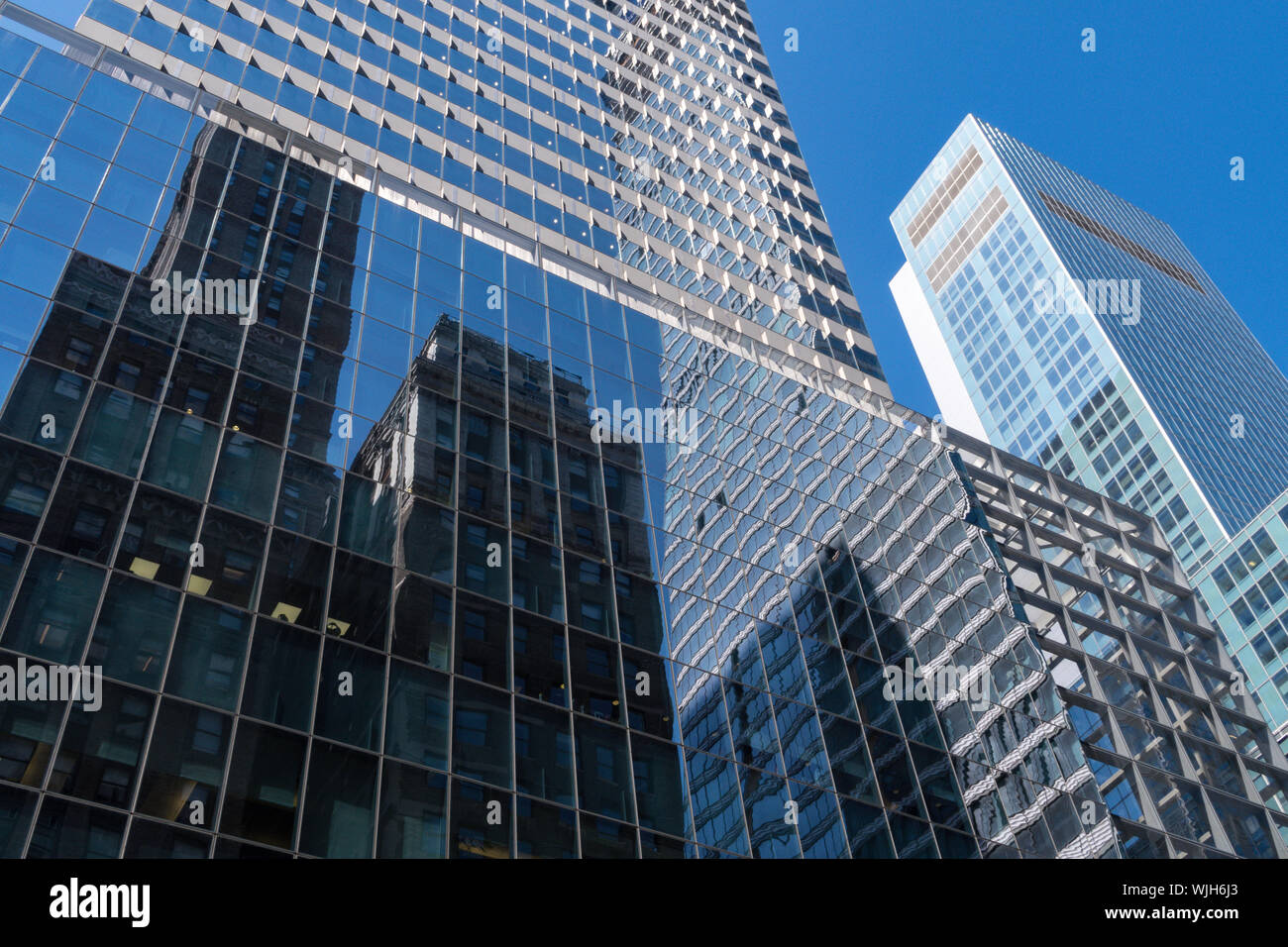 Reflections of Skyscrapers along Madison Avenue on the Glass Facade