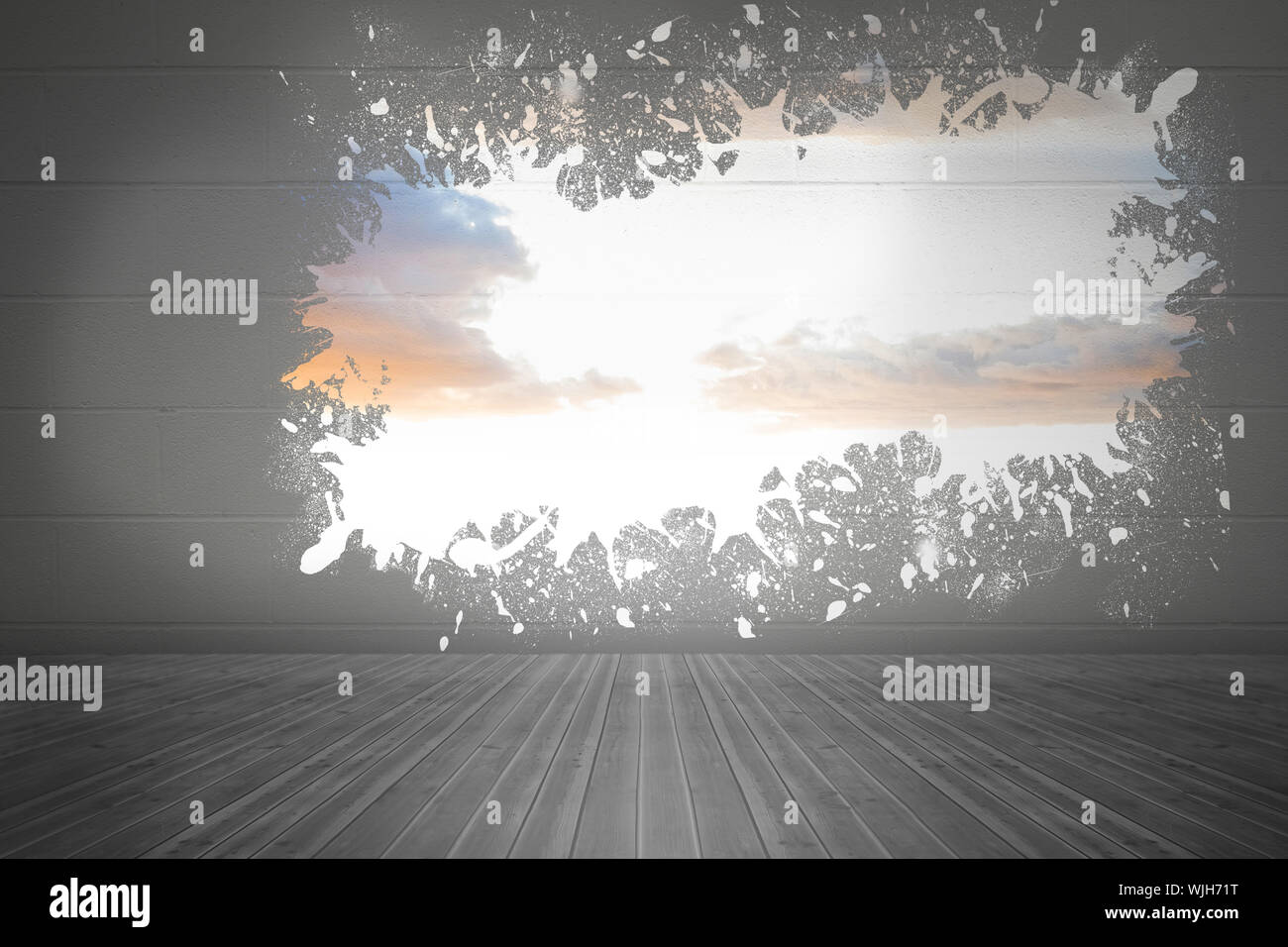 Splash on wall revealing bright sky Stock Photo