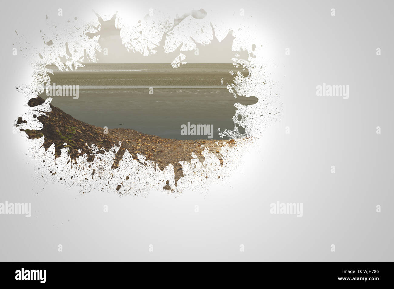 Splash on wall revealing beach Stock Photo