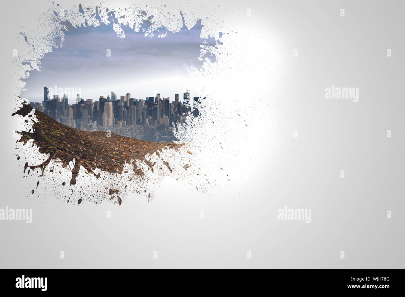 Splash on wall revealing cityscape Stock Photo