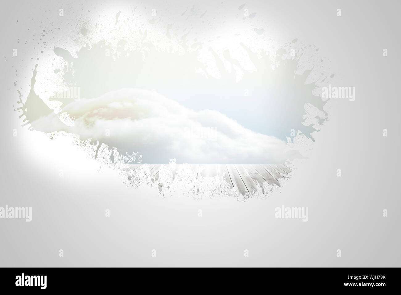 Splash on wall revealing bright sky Stock Photo
