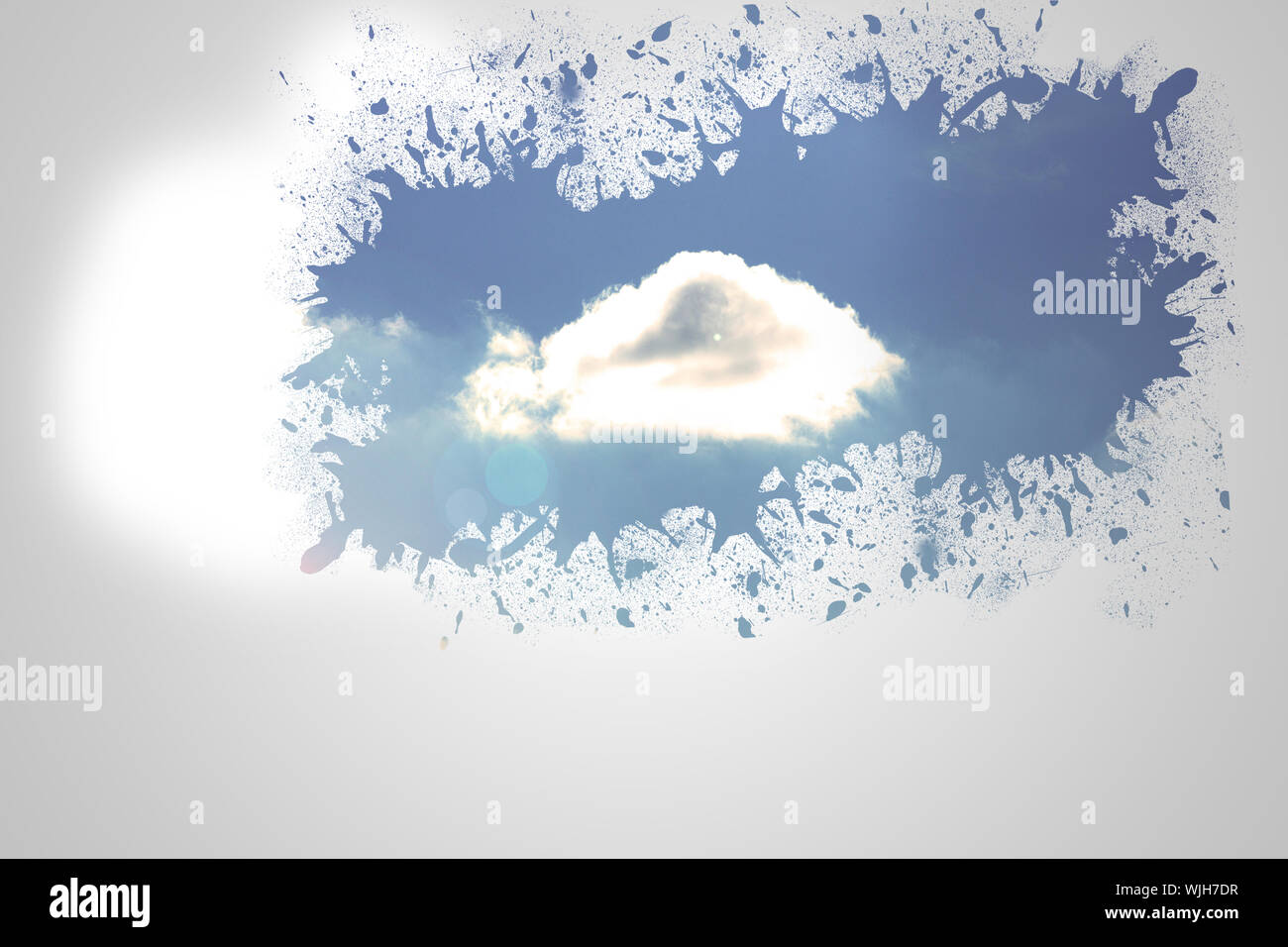 Splash on wall revealing cloud Stock Photo