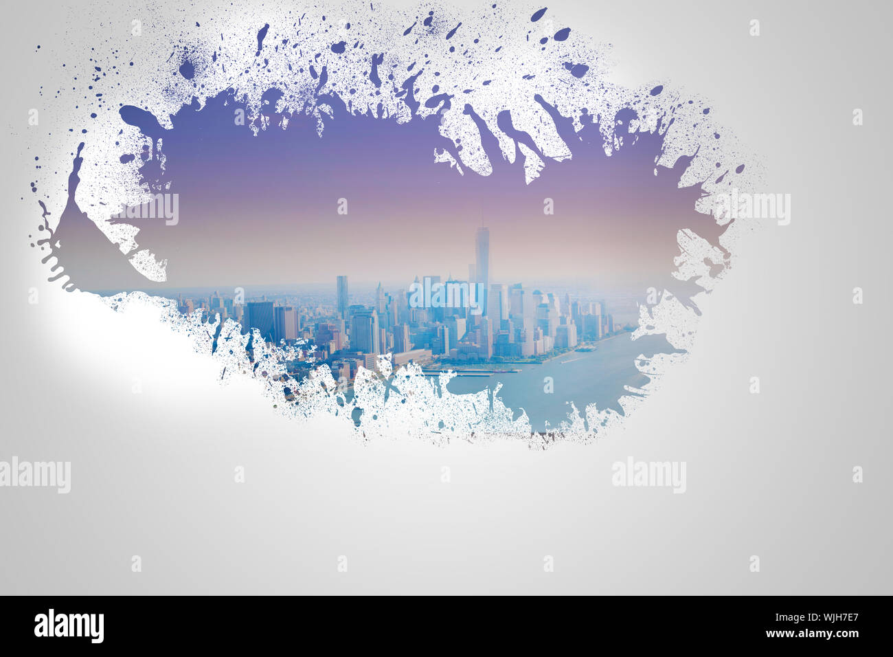 Splash on wall revealing cityscape Stock Photo