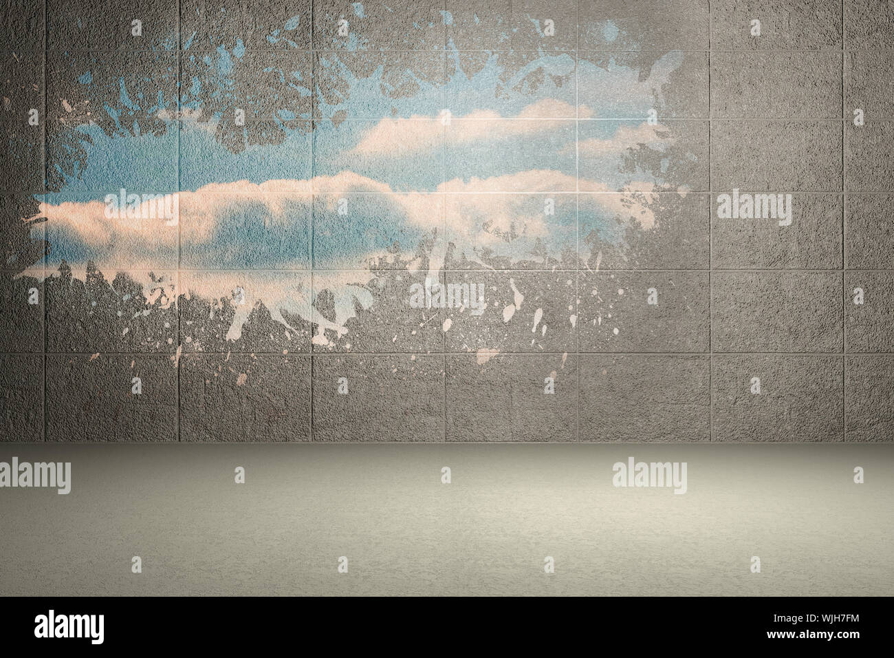 Splash on wall revealing bright sky Stock Photo