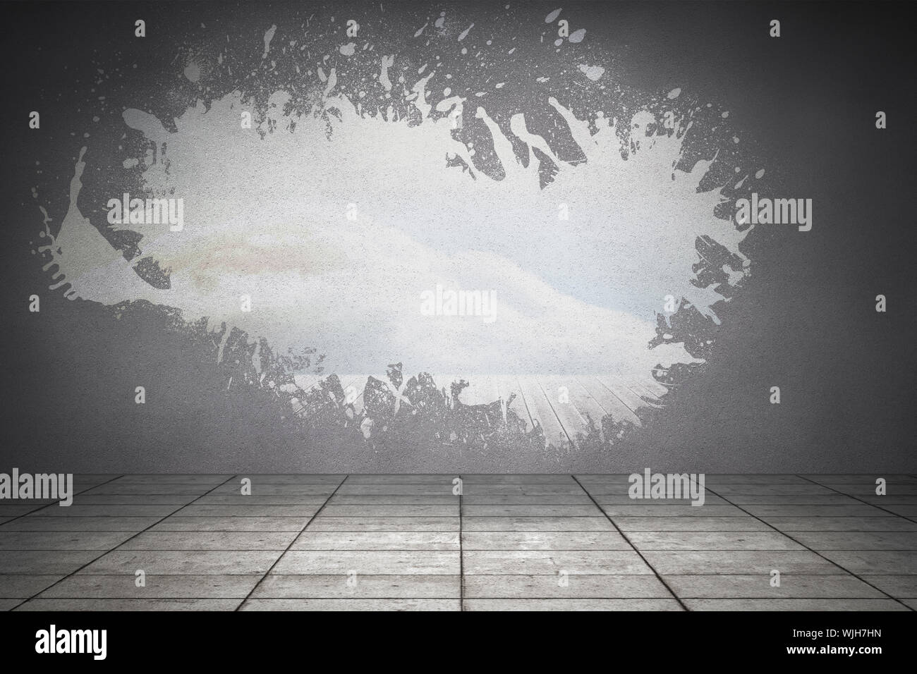 Splash on wall revealing bright sky Stock Photo