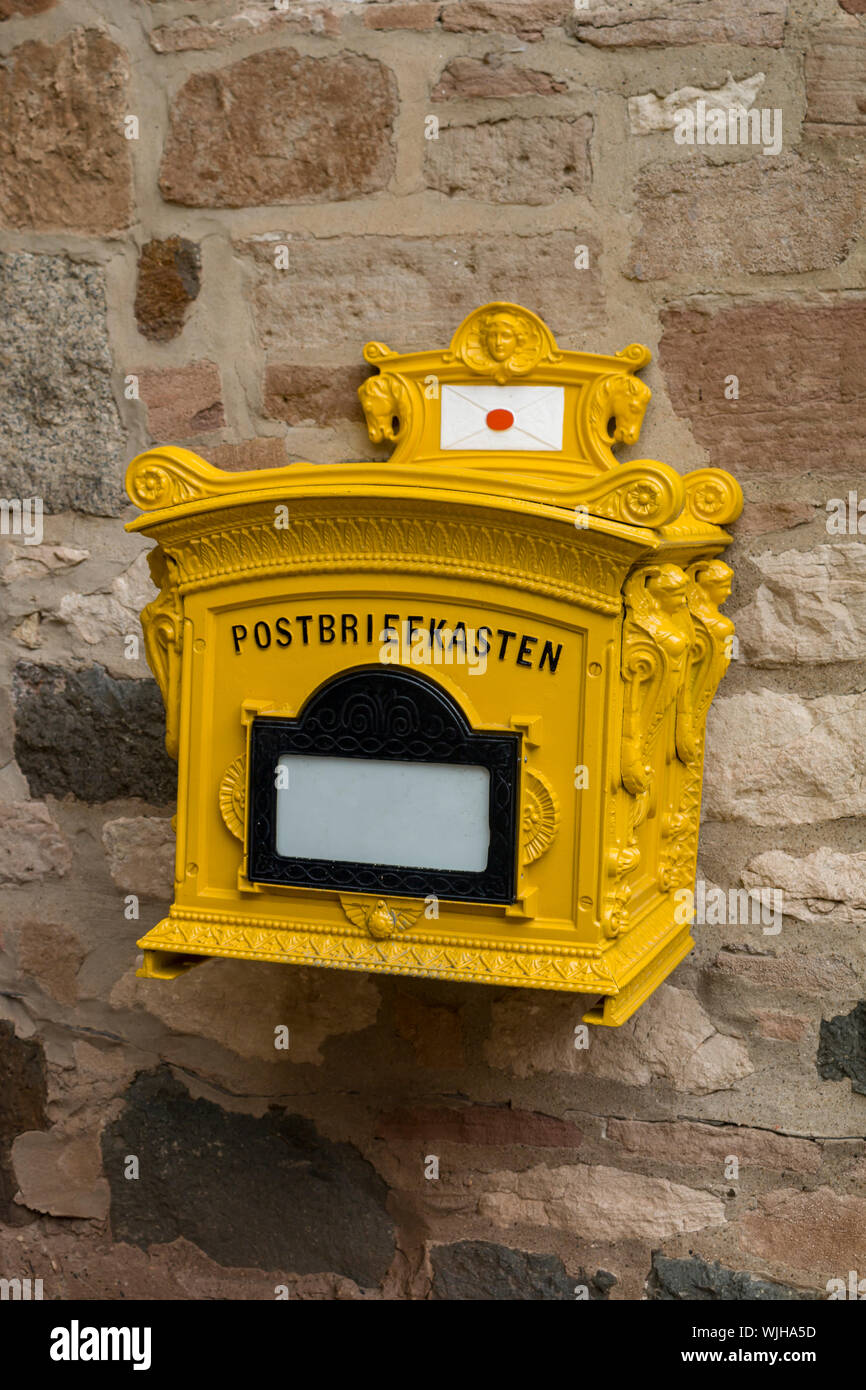 old rusty mailbox on the timbered wall Stock Photo