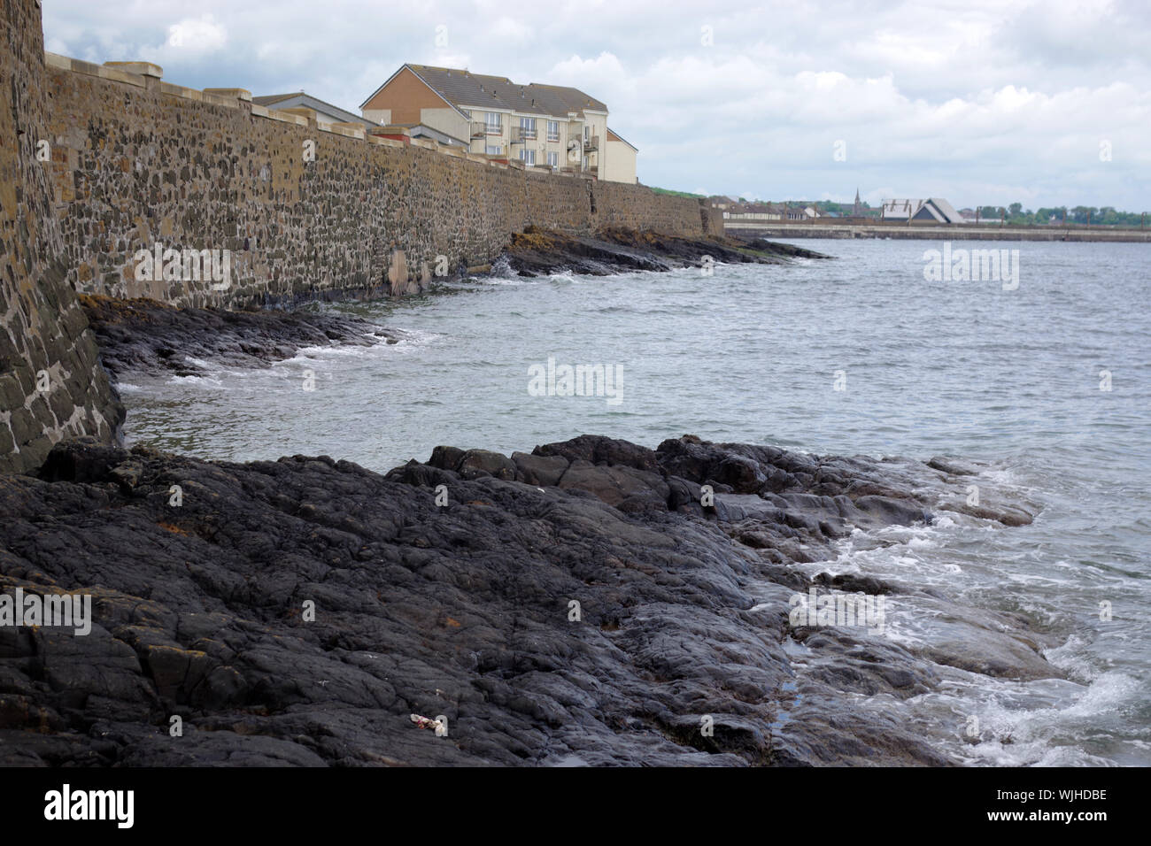 The tide is in on the rocks at Saltcoats. Saltcoats is a small town on the west coast of North Ayrshire, Scotland. Stock Photo