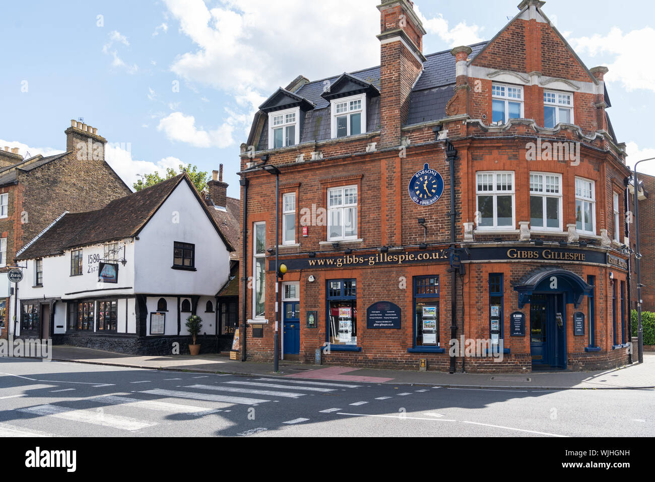 Gibbs Gillespie estate agents office building, Pinn House, stands next to  the old Victory pub building, High Street, Pinner, Middlesex, England Stock  Photo - Alamy