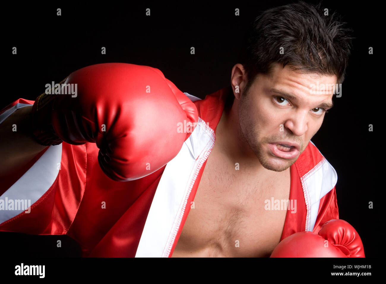 Professional boxer man punching Stock Photo