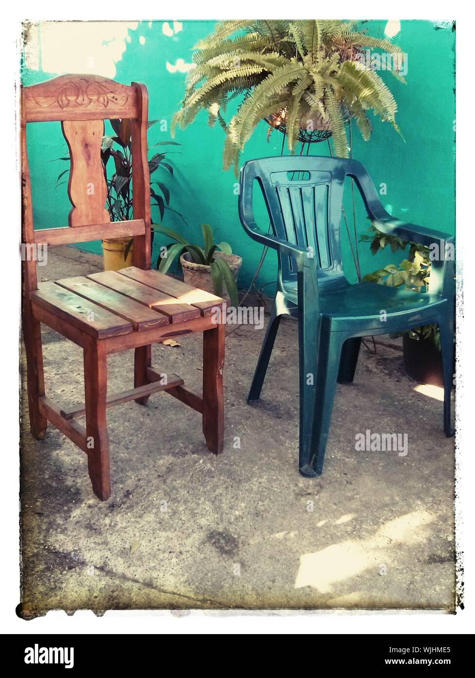 Plastic And Wooden Chairs Stock Photo Alamy