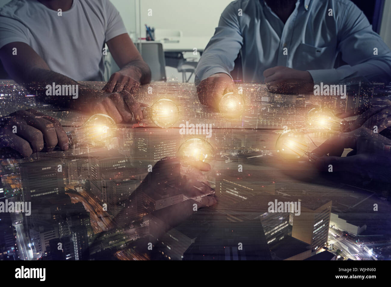 Teamwork and brainstorming concept with businessmen that share an idea with a lamp. Concept of startup. Double exposure Stock Photo