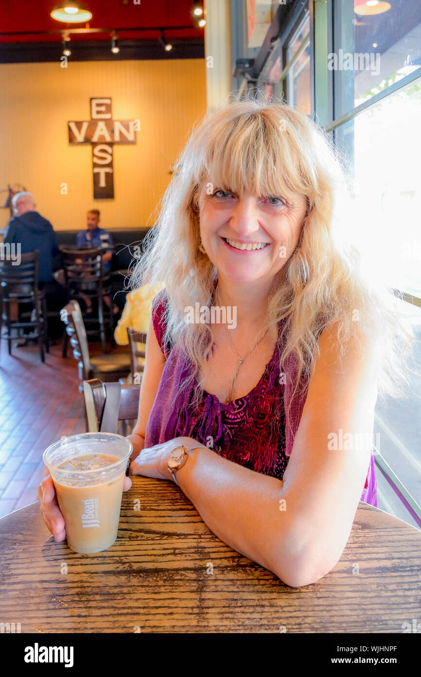 Women enjoying coffee in JJ Bean coffee shop, East Vancouver, British Columbia, Canada Stock Photo