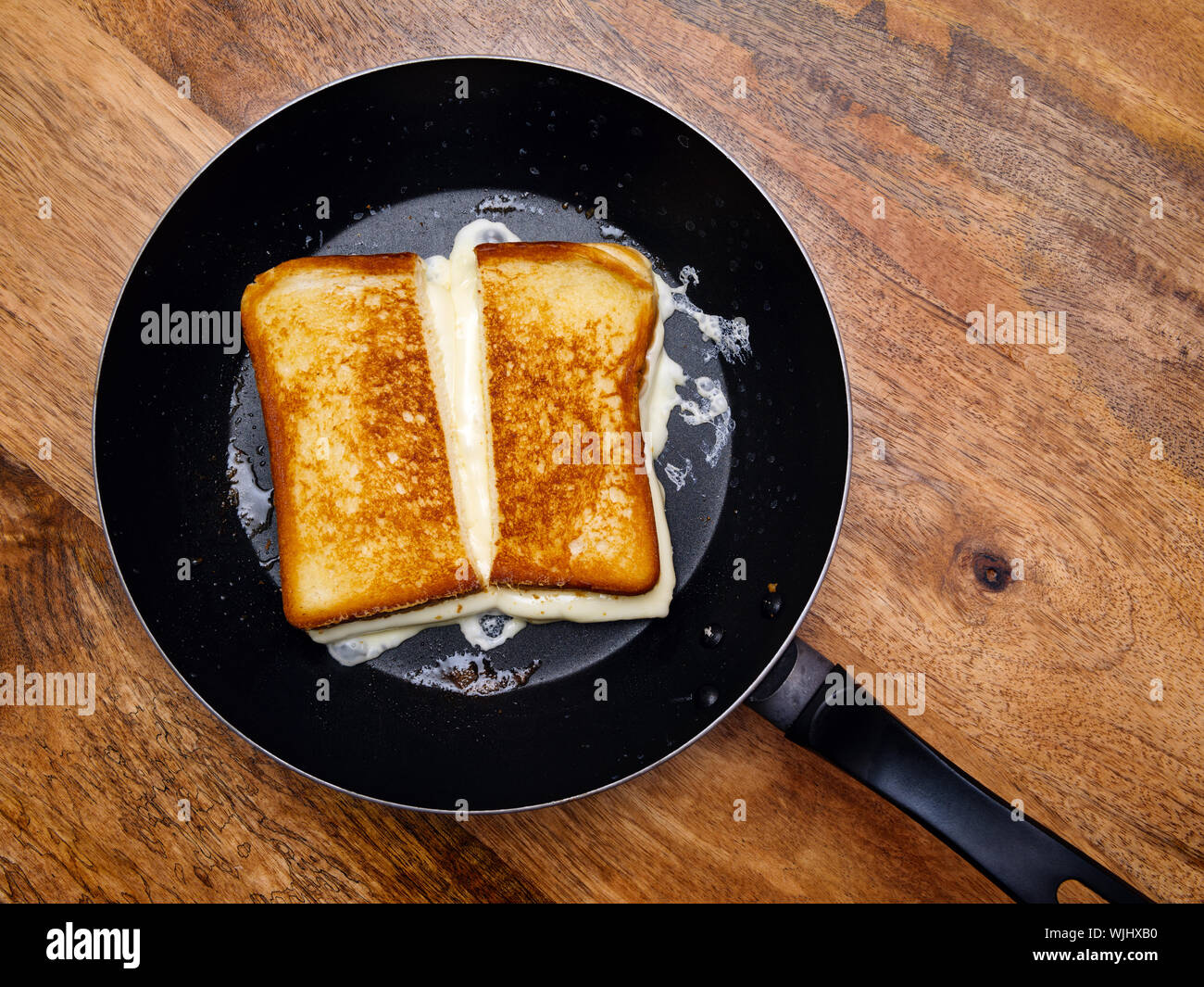 Photo of a grilled cheese sandwich cooking in a large frying pan Stock  Photo - Alamy