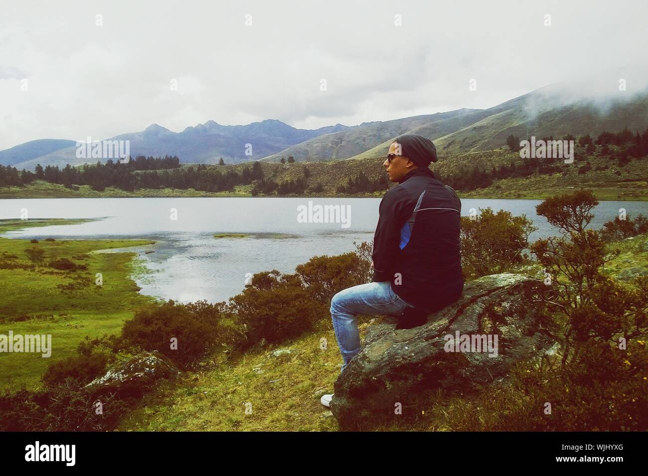 Mountain man sitting on a rock hi-res stock photography and images - Alamy