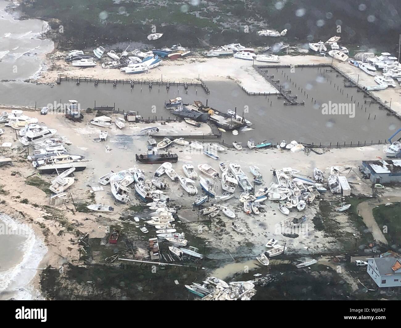 Marsh Harbour, Abaco, Bahamas. 02 September, 2019. Boats are tossed across the land as Hurricane Dorian destroyed the Abaco Beach Resort & Boat Harbour September 2, 2019 in Marsh Harbour, Abaco, The Bahamas. Dorian struck the small island nation as a Category 5 storm with winds of 185 mph.  Credit: Hunter Medley/USCG/Alamy Live News Stock Photo