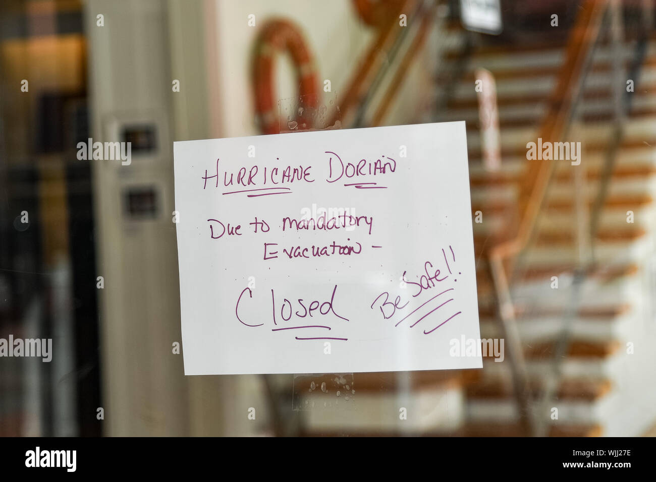 Charleston, South Carolina, USA. 03 September 2019. A closed sign on a store on King Street in the historic downtown in preparation for Hurricane Dorian September 3, 2019 in Charleston, South Carolina. The slow moving monster storm devastated the Bahamas and is expected to reach Charleston as a Category 2 by Thursday morning.  Credit: Richard Ellis/Alamy Live News Stock Photo