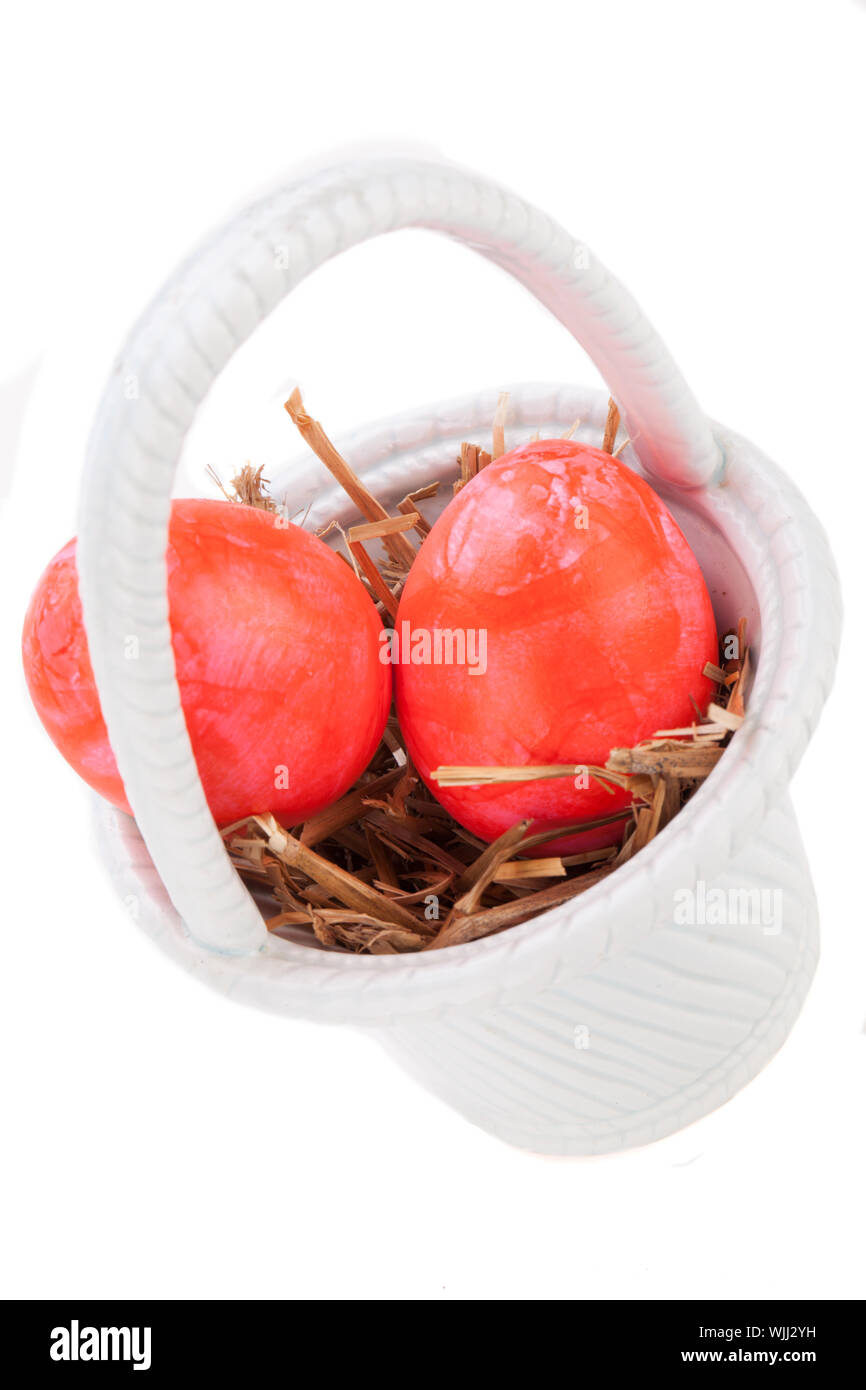 Basket of brightly coloured Easter Eggs Stock Photo