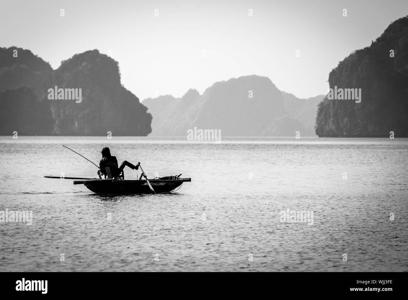 Men in rowing boat Black and White Stock Photos & Images - Alamy