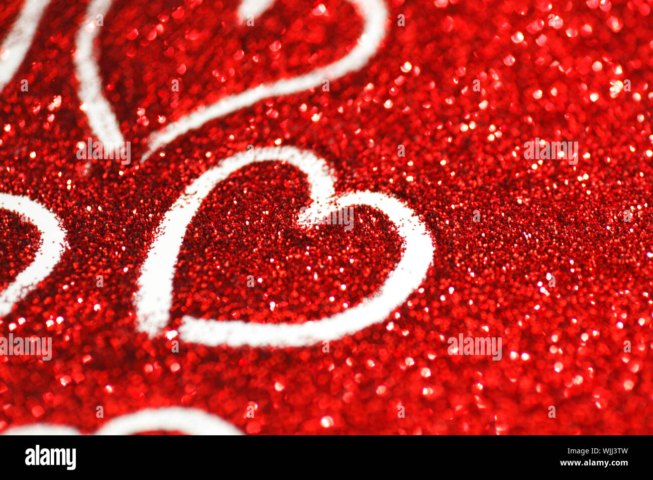 Red glitter Valentines day card with hearts Stock Photo - Alamy