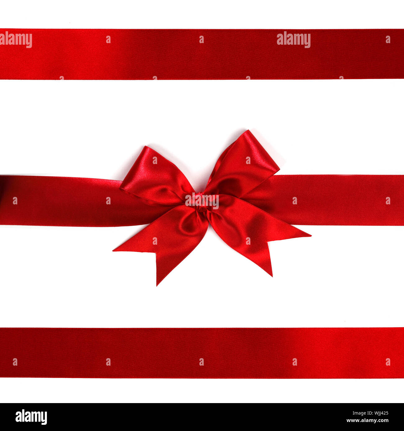 Red ribbon with bow isolated on white background Stock Photo - Alamy