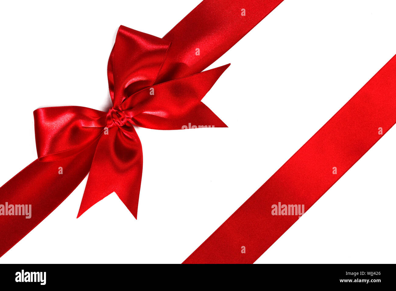 Red ribbon with bow isolated on white background Stock Photo - Alamy
