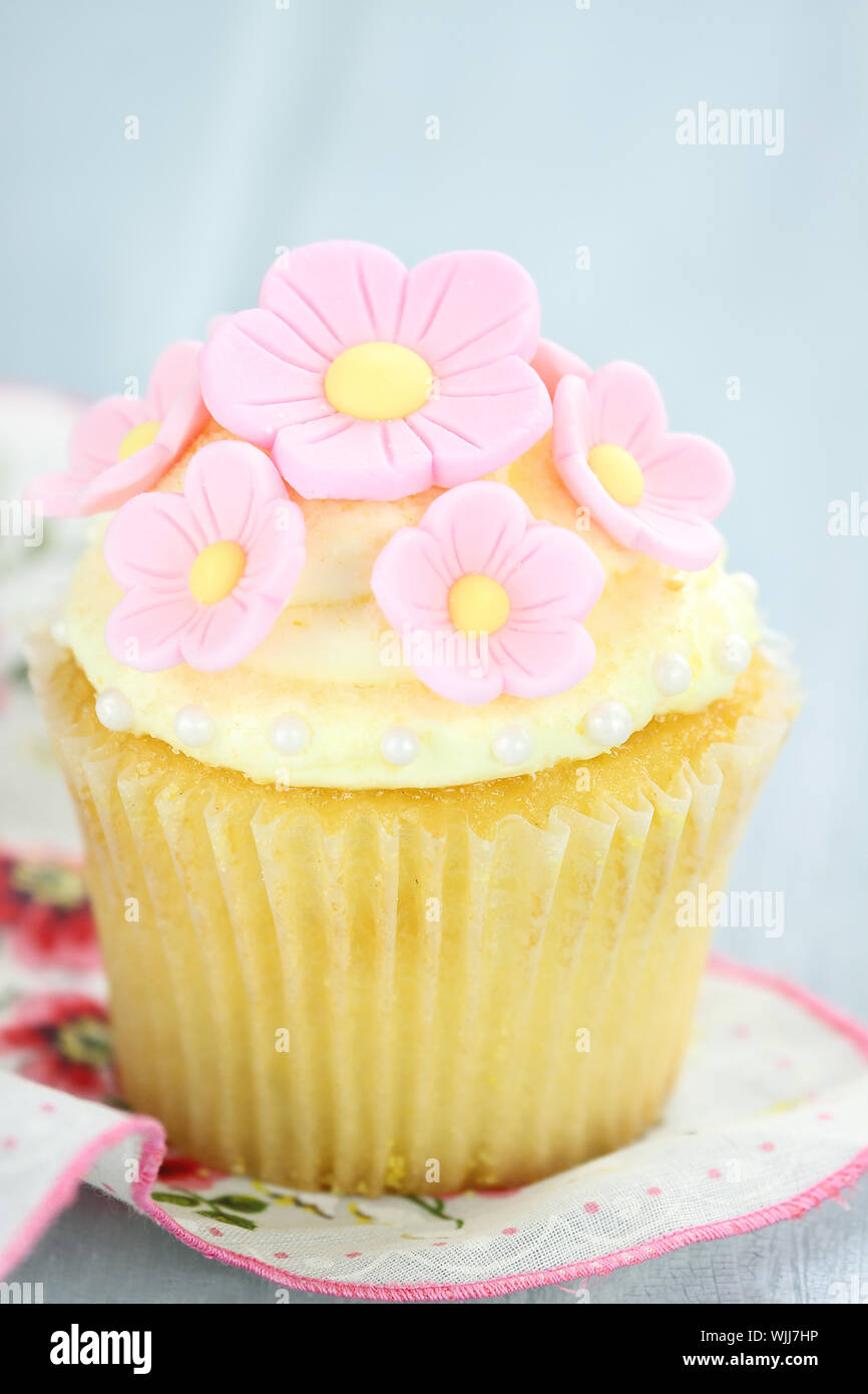 Pretty yellow and pink cupcakes with extreme shallow depth of field