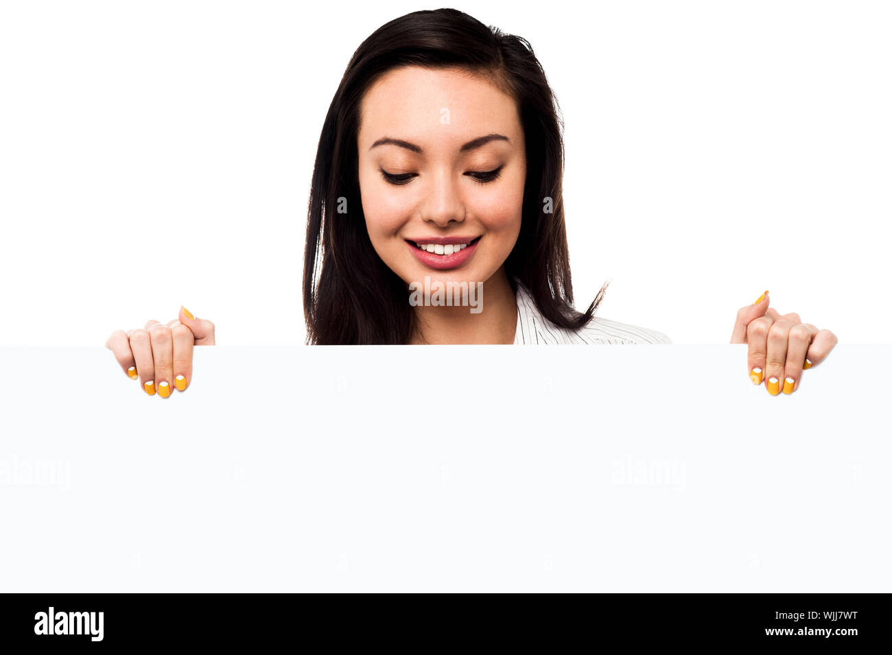 Pretty young girl holding blank banner ad, business concept Stock Photo ...