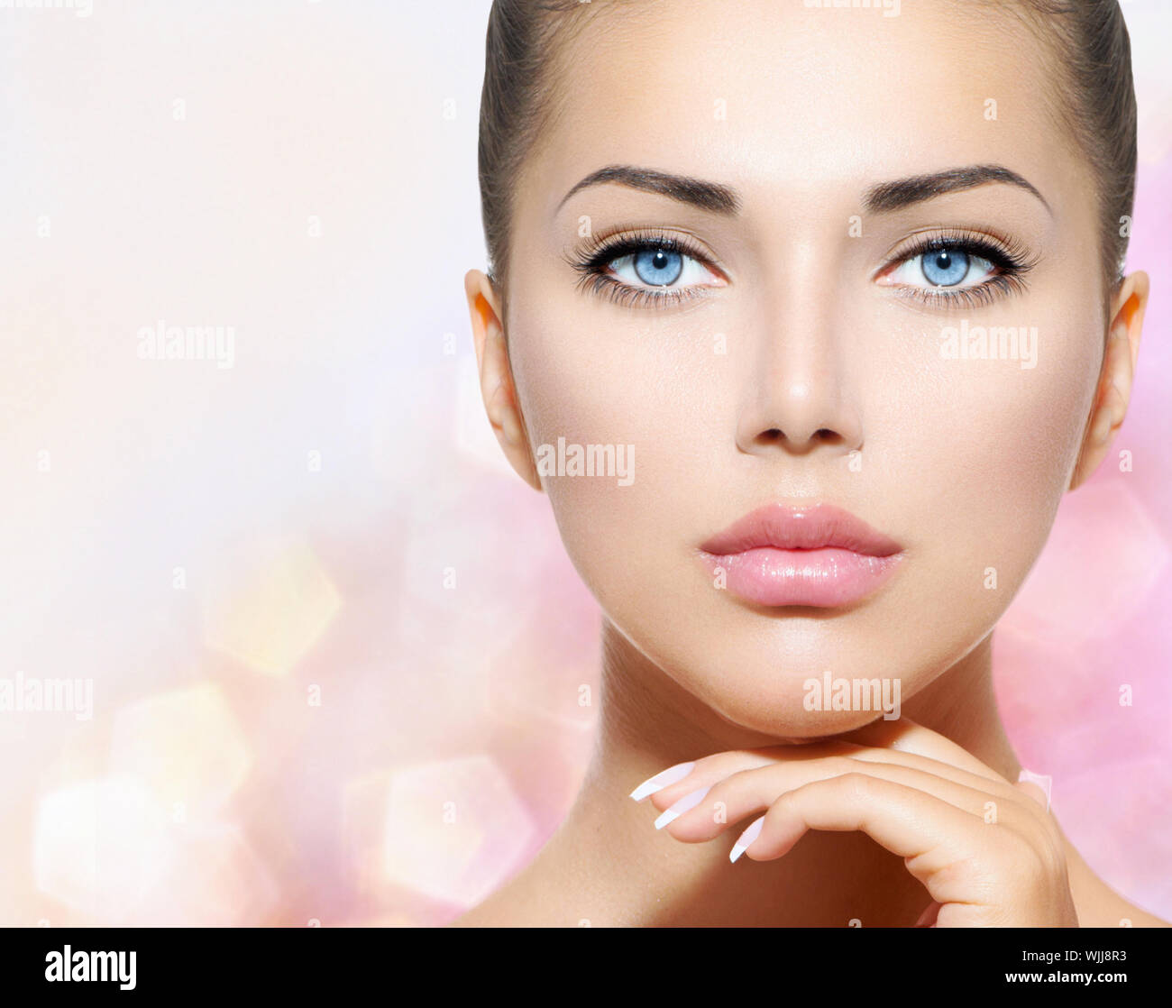 Beauty Portrait. Beautiful Spa Woman Touching her Face Stock Photo - Alamy