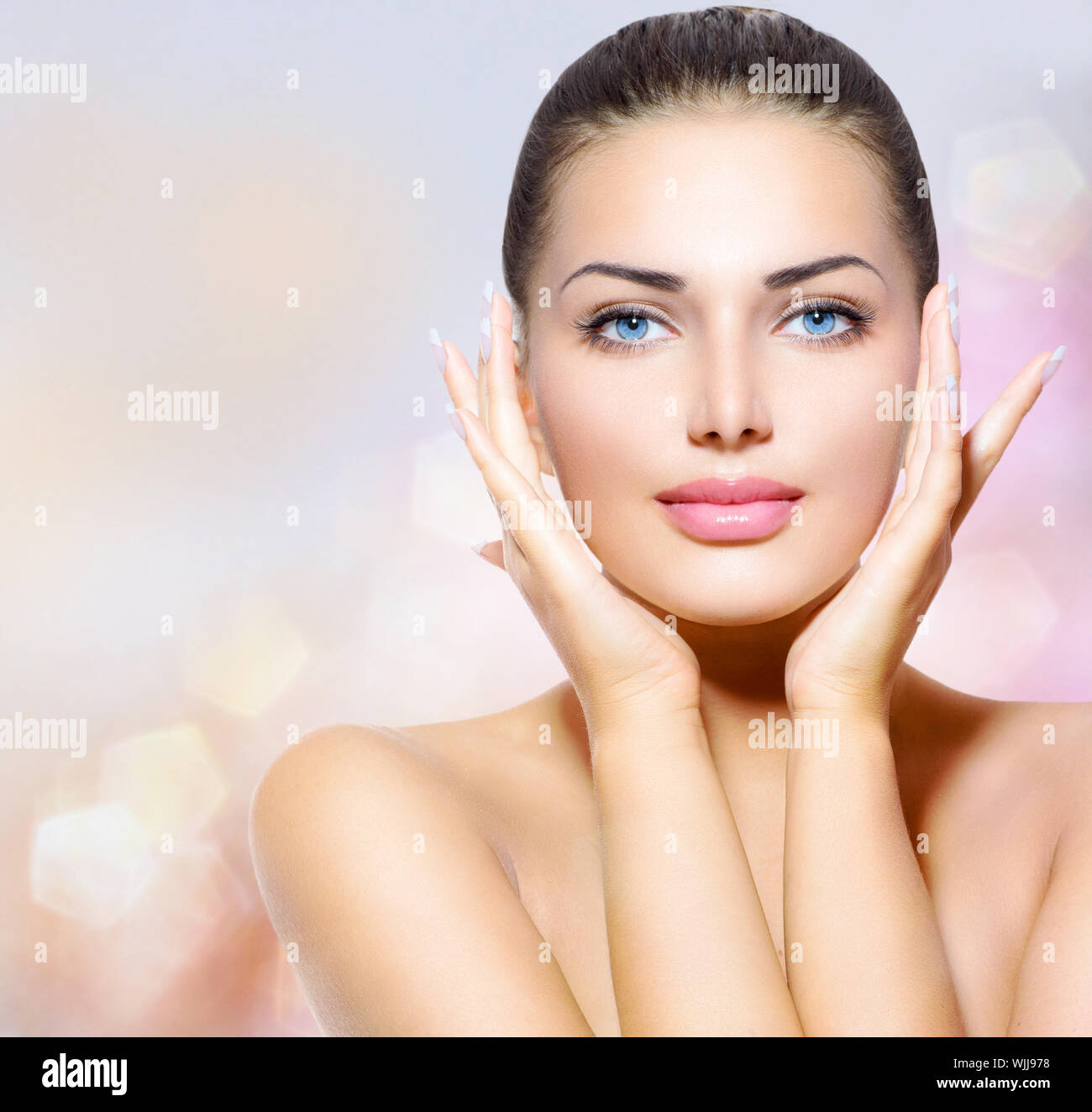 Beauty Portrait. Beautiful Spa Woman Touching her Face Stock Photo - Alamy