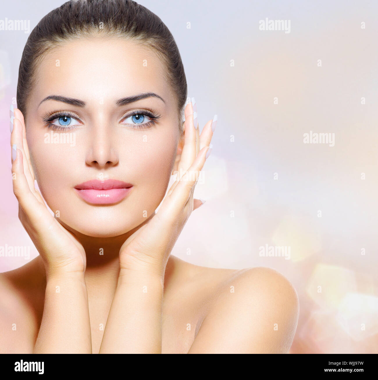 Beauty Portrait. Beautiful Spa Woman Touching her Face Stock Photo - Alamy