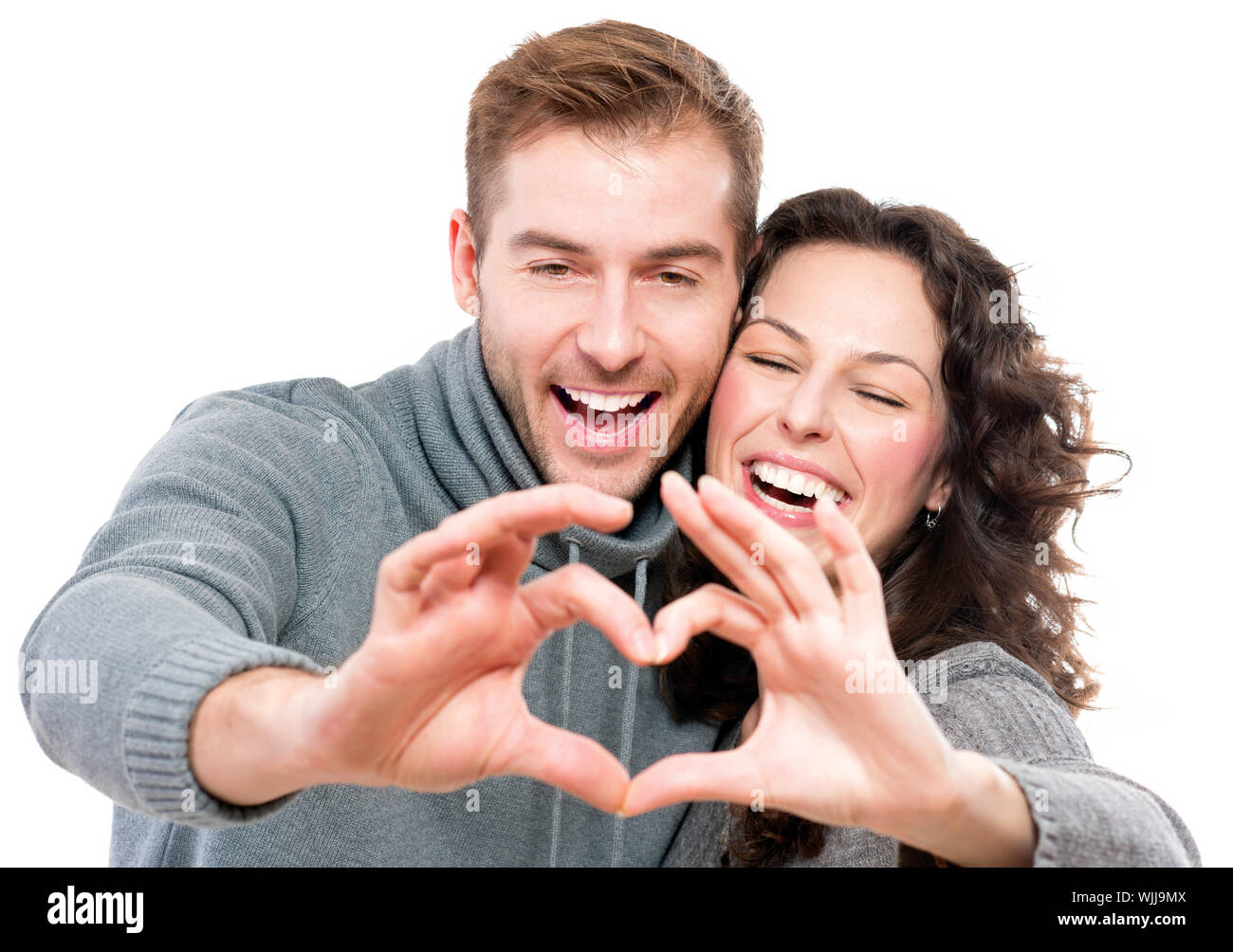 Valentine Couple Making Shape of Heart by their Hands Stock Photo - Alamy