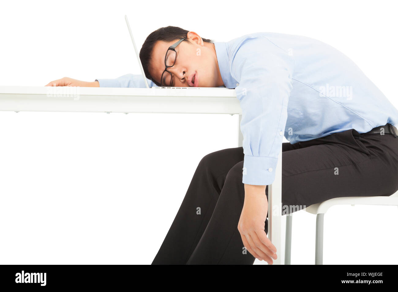 Tired overworked businessman sleeps on desk Stock Photo Alamy