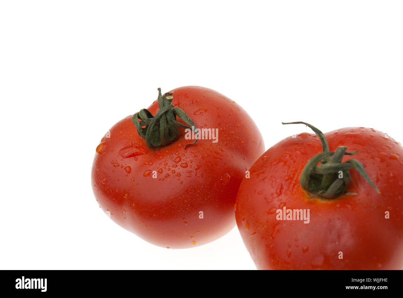 The red tomatoes isolated on white background Stock Photo - Alamy