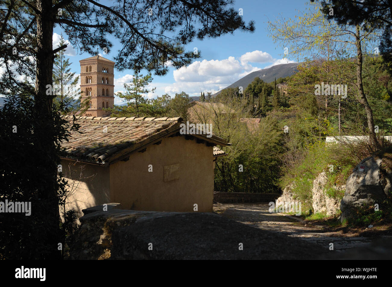Santa Scholastica's Benedictine Monastery - External view with the bell tower from a path - Subiaco (Rome) Italy Stock Photo