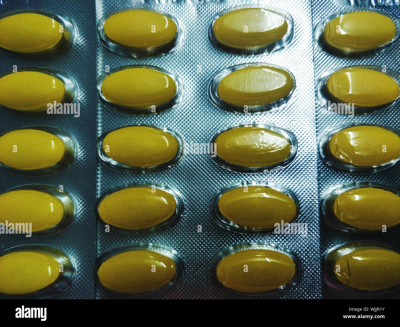 Download Full Frame Shot Of Yellow Pills In Blister Packs Stock Photo Alamy Yellowimages Mockups