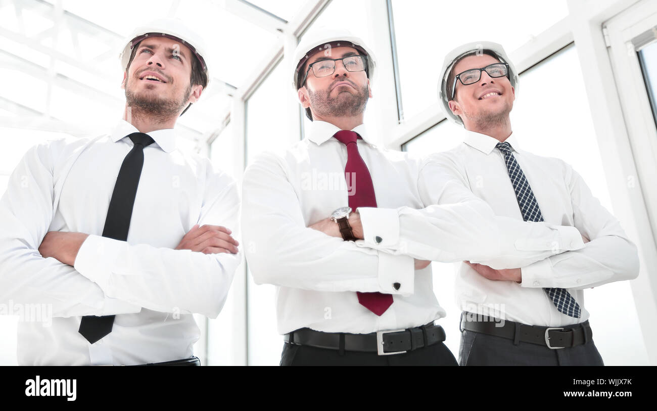 three architects standing in an empty office Stock Photo
