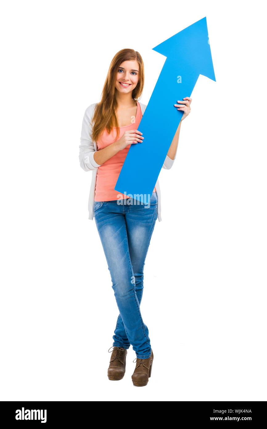 Beautiful blonde woman holding a blue arrow Stock Photo - Alamy