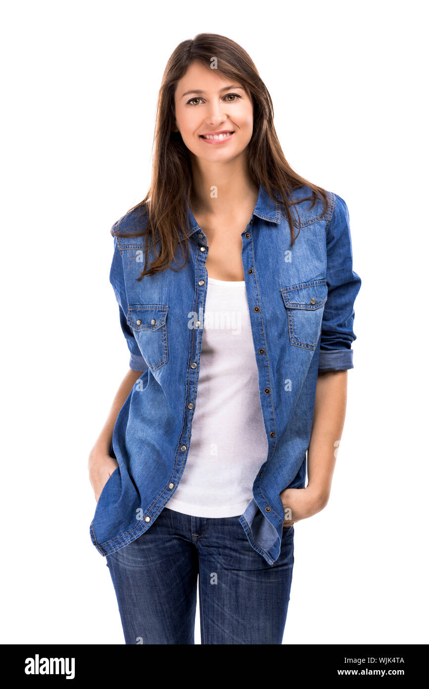 Beautiful woman standing over a white background with hands on the ...