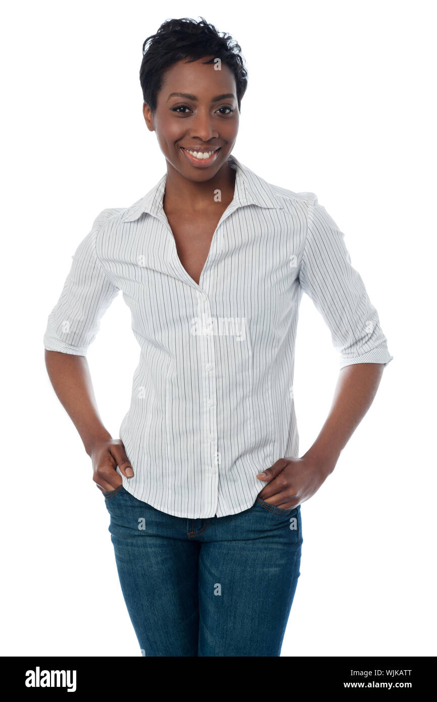 Beautiful woman posing with hands in pockets Stock Photo - Alamy