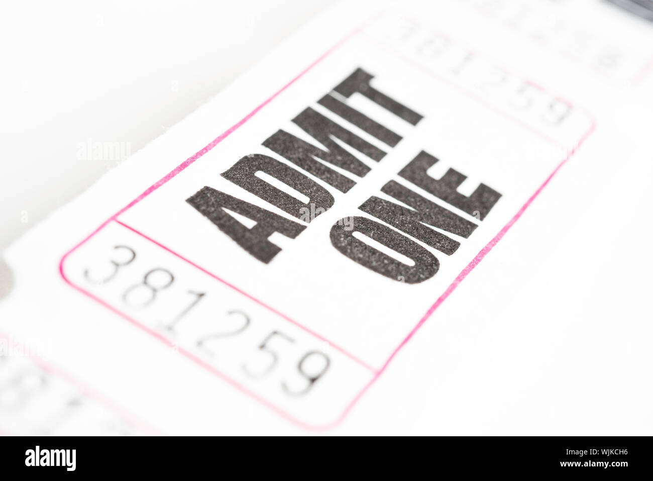 A macro or close-up shot of a strip of generic white sequentially numbered admittance paper ticket. Stock Photo