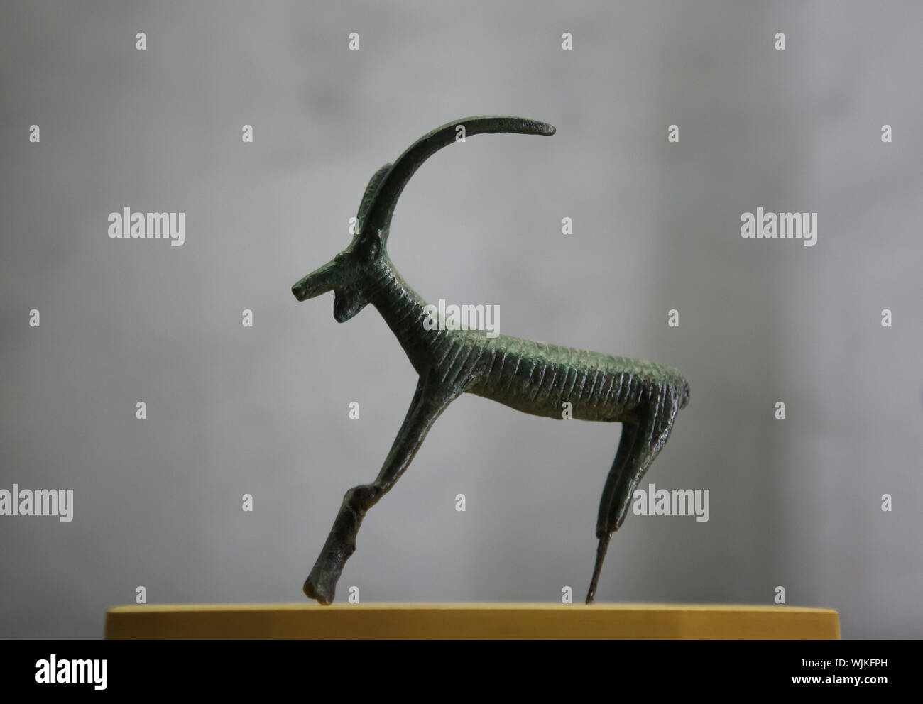 Alpine ibex (Capra ibex) or Pyrenean ibex (Capra pyrenaica pyrenaica). Iberian, Celtic or Etruscan statuette on display in the Museum of Fine Arts (Musée des Beaux-Arts de Lyon) in Lyon, France. Stock Photo