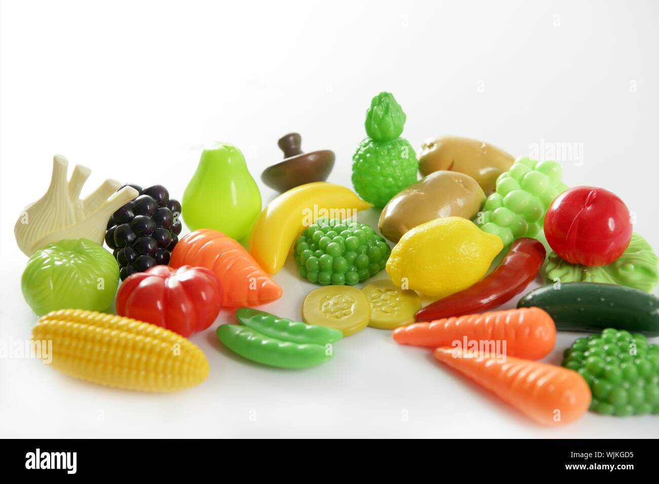 Plastic game, fake varied vegetables and fruits. Children food education toy Stock Photo Alamy