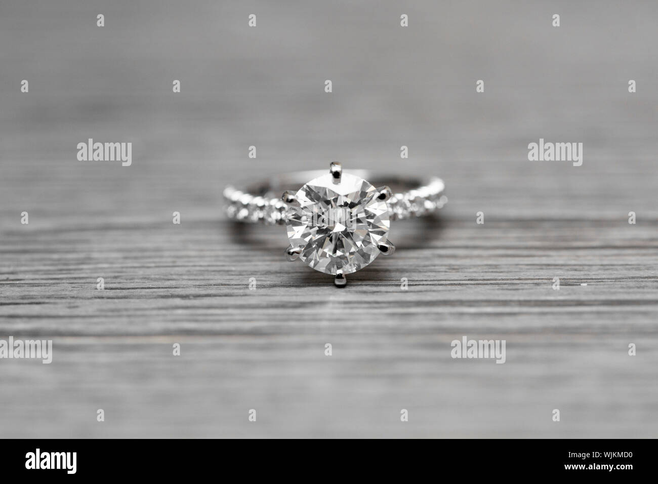 Close-up Of Diamond Ring On Table Stock Photo